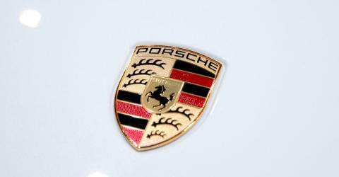 Porsche warns restructuring, trade tensions to hit year ahead