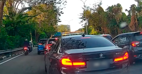 BMW 5 series passenger caught tossing trash out of car window